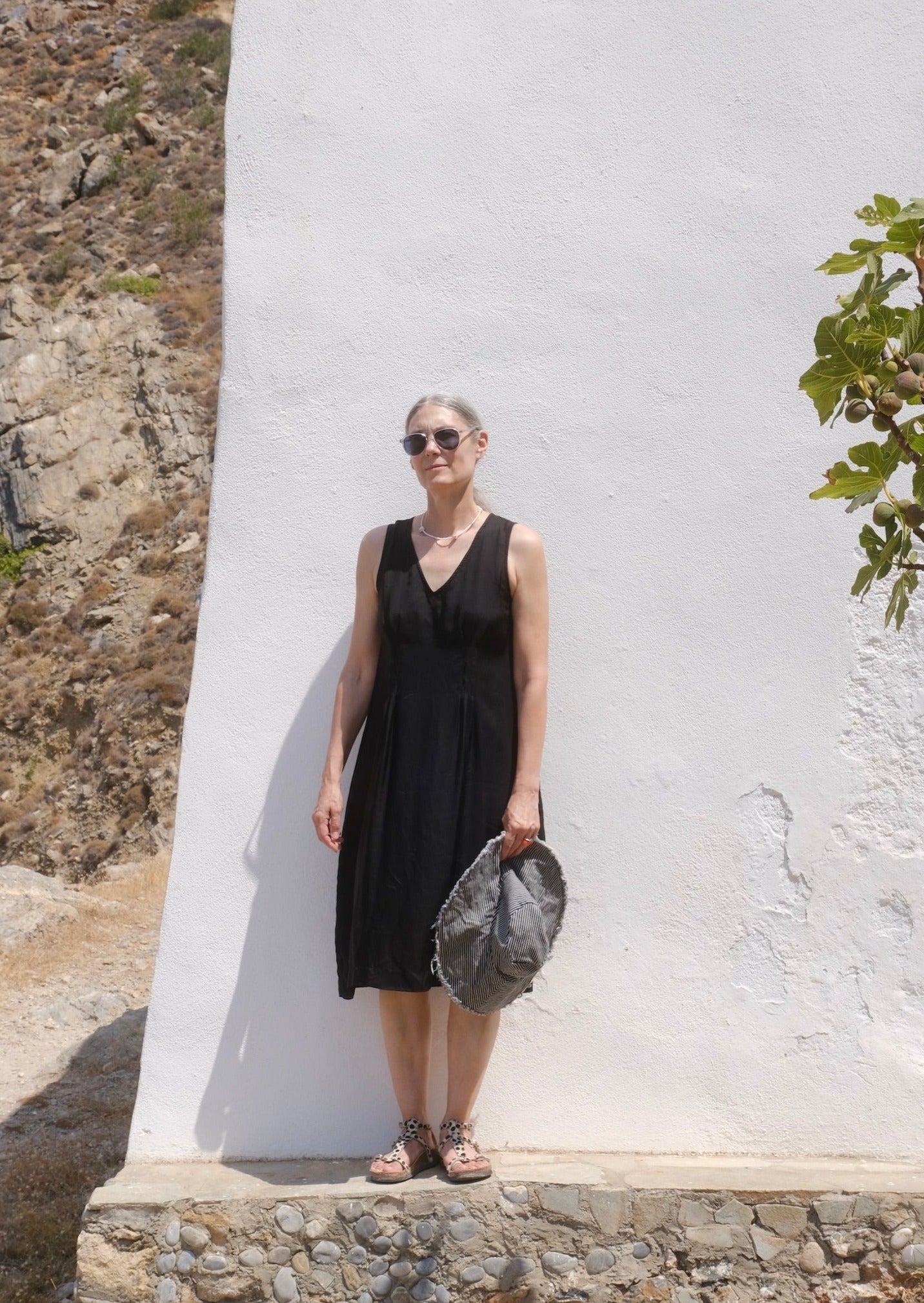 black rayon pleated shift dress on model