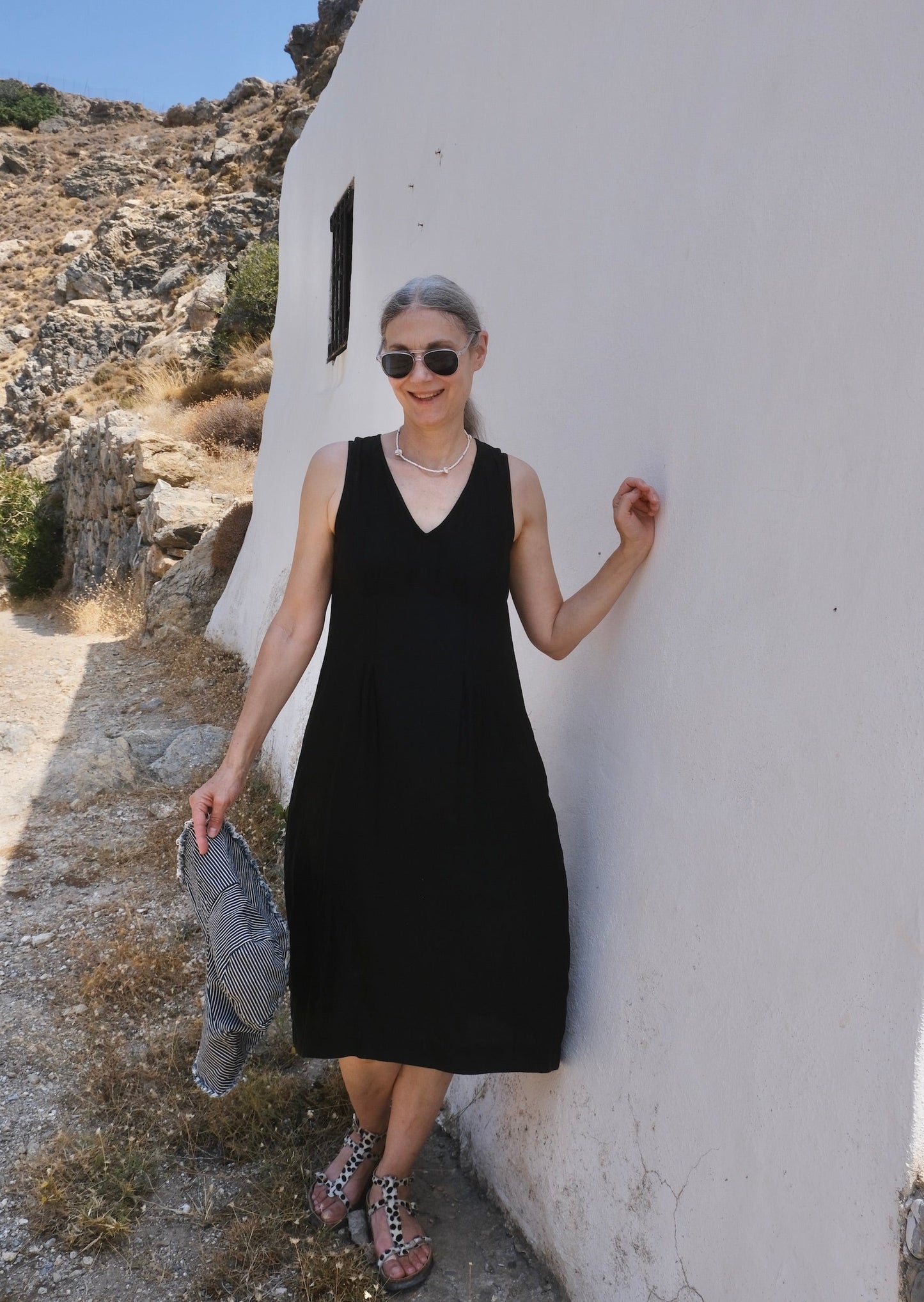 black rayon pleated shift dress on model