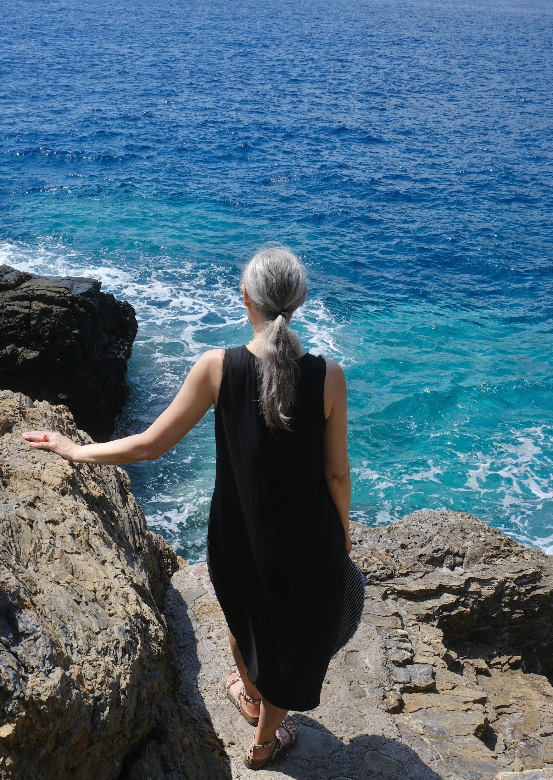 black rayon pleated shift dress on model back view