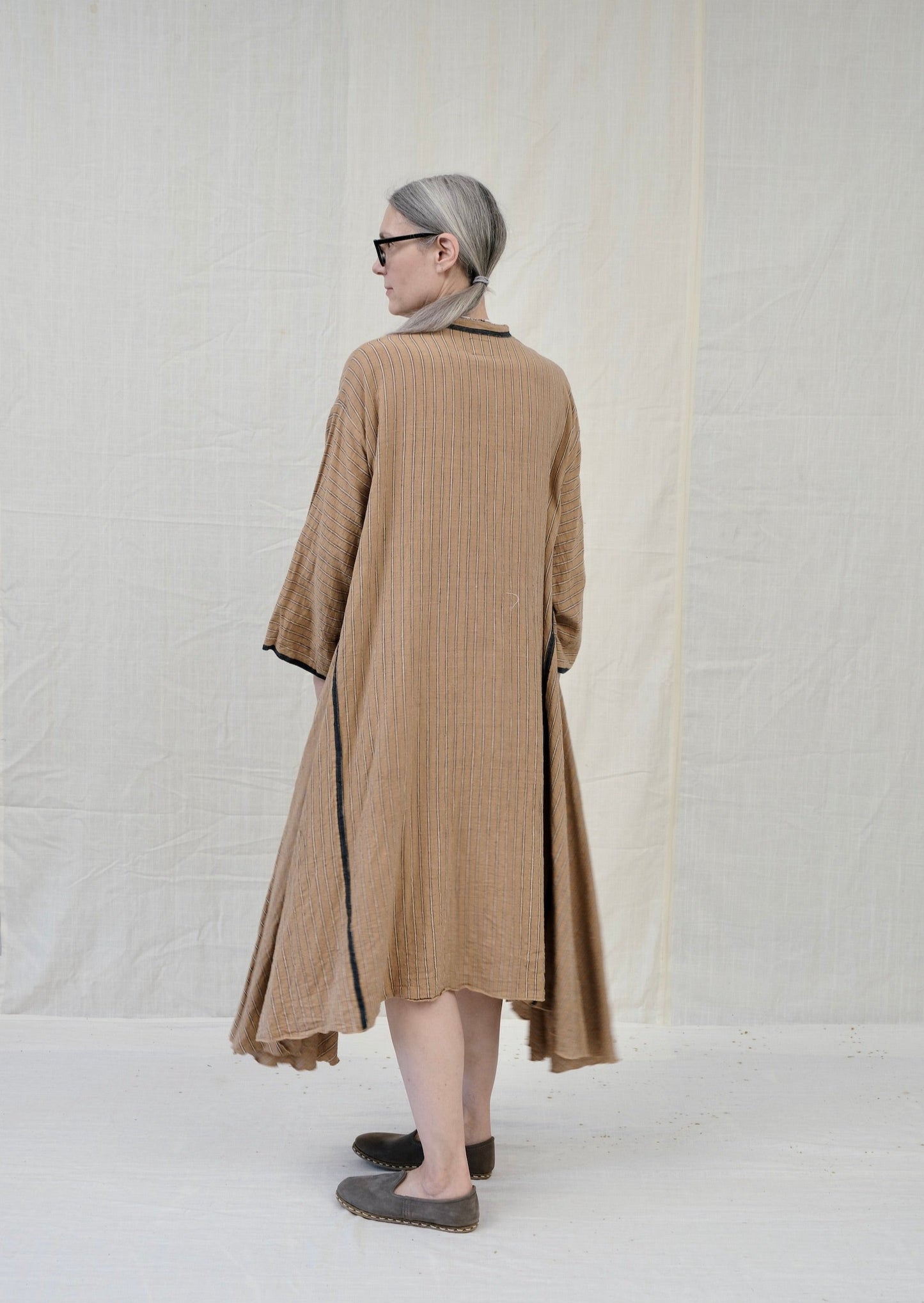 Dervish dress brown stripe on model back view
