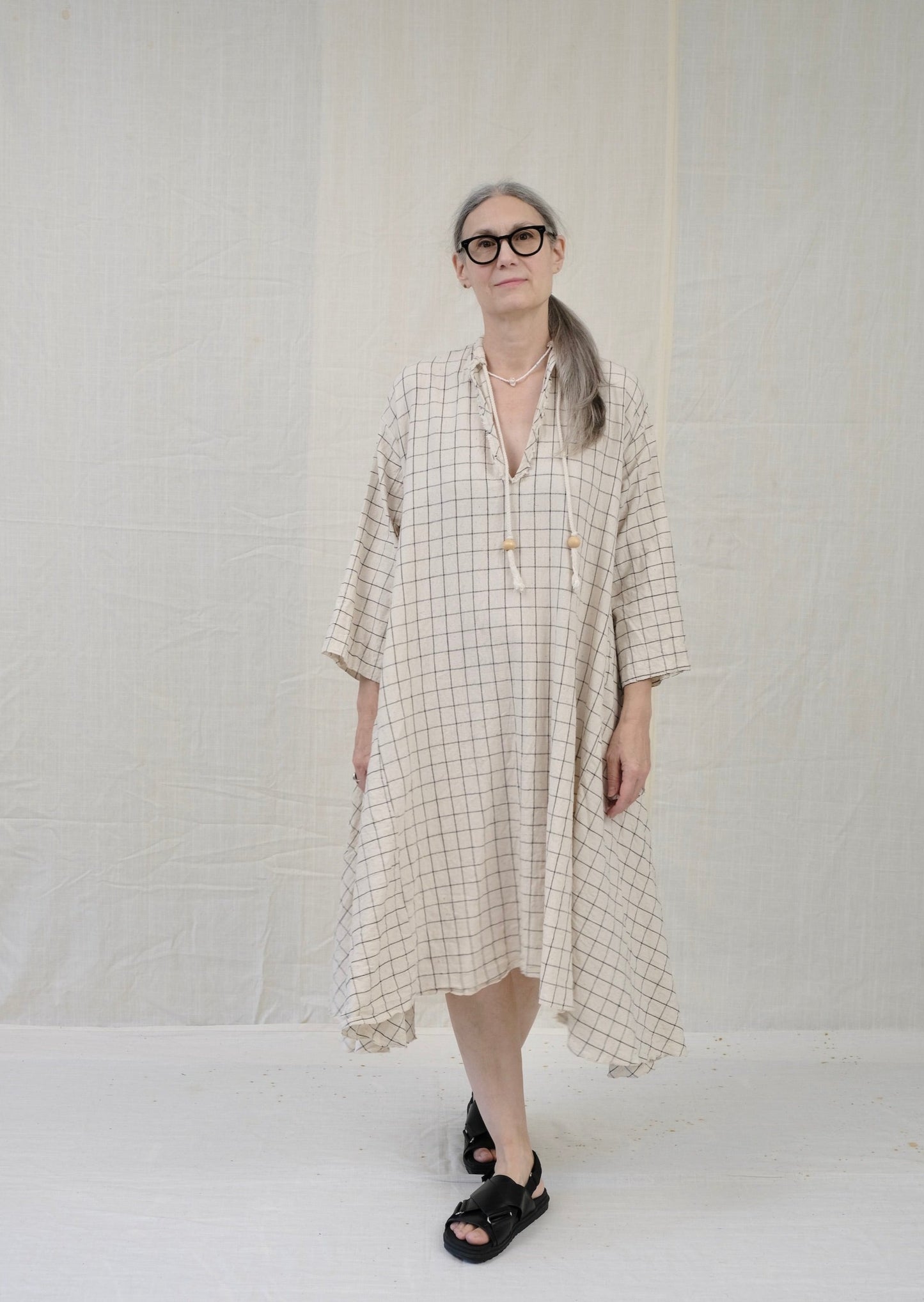 Dervish dress natural with black windowpane on model front view