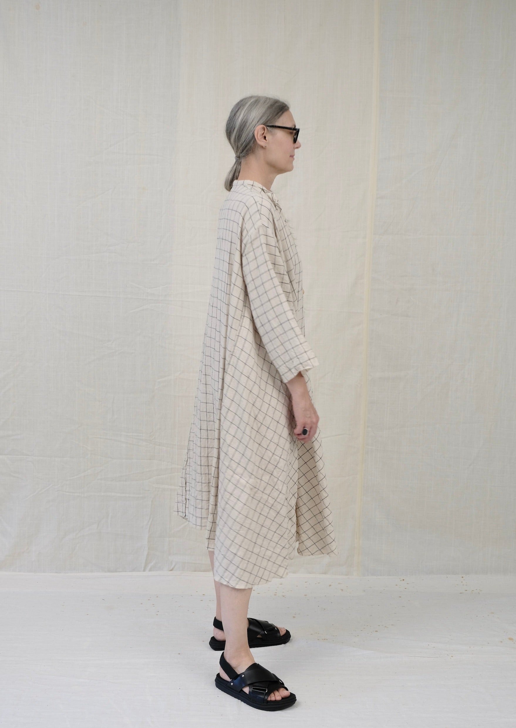 Dervish dress natural with black windowpane on model