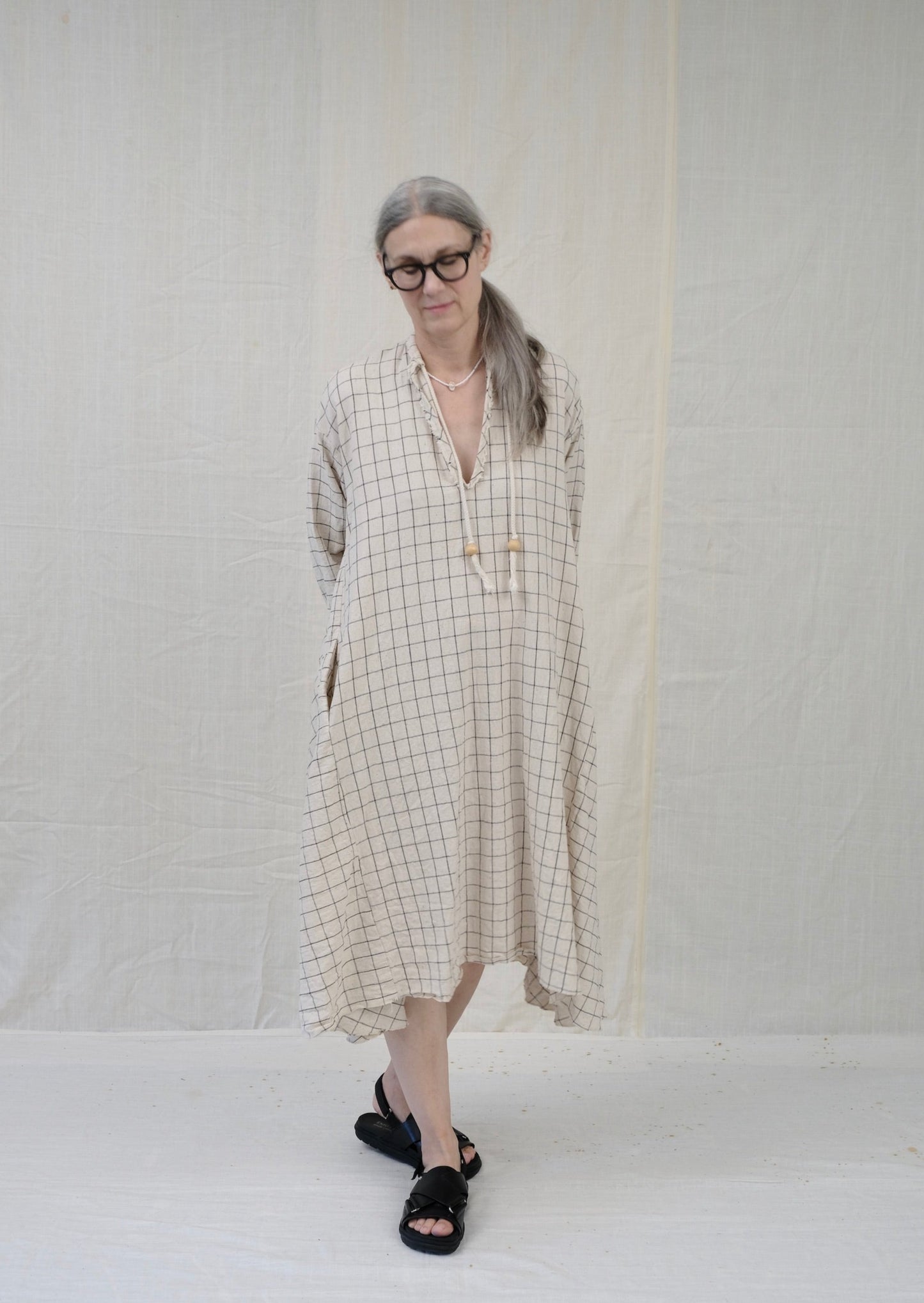 Dervish dress natural with black windowpane on model