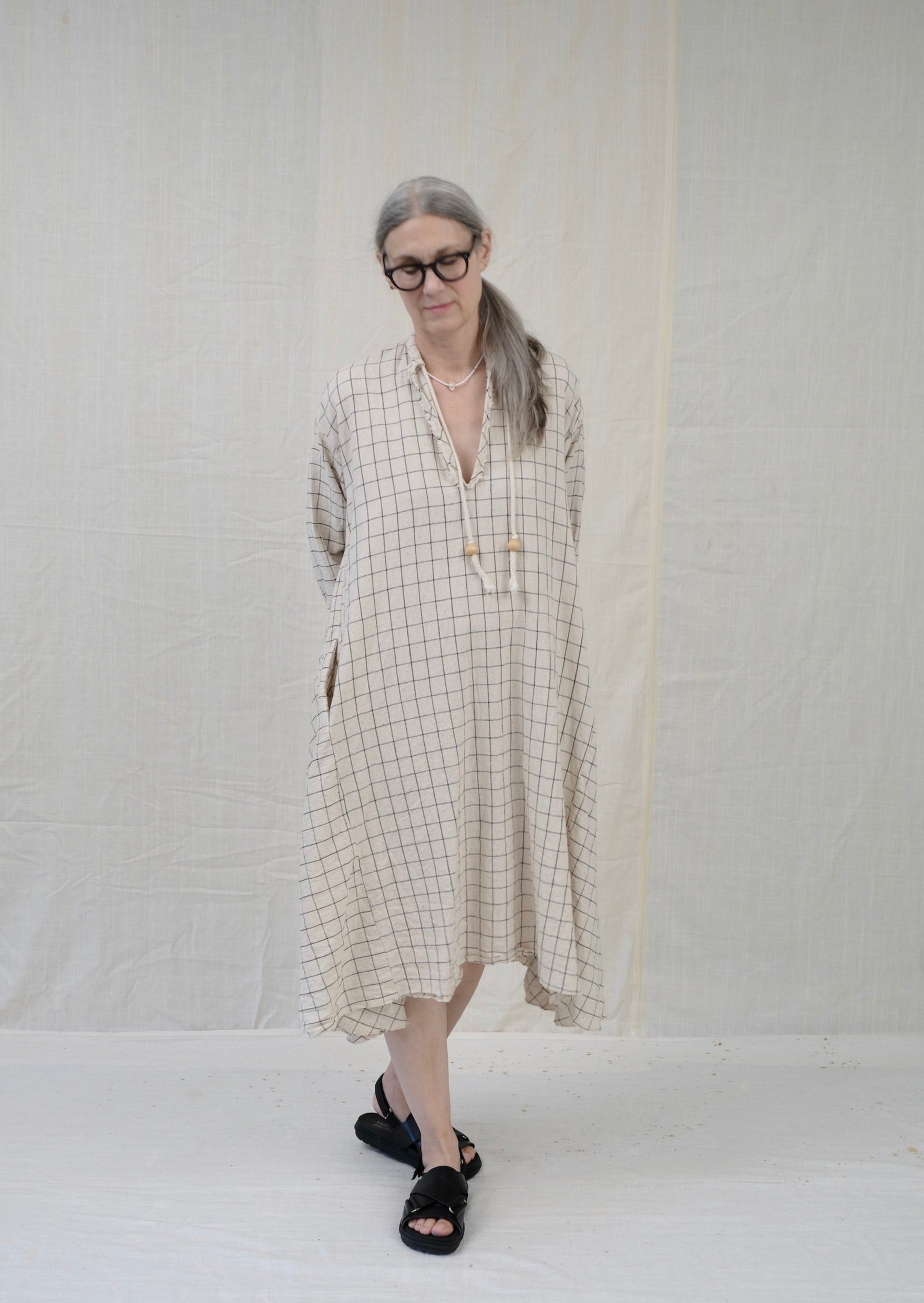 Dervish dress natural with black windowpane on model