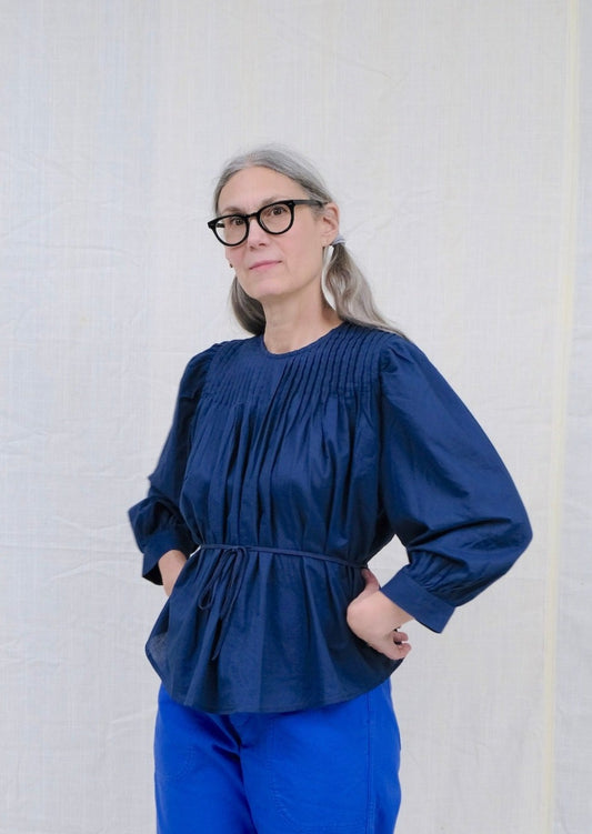 Indigo pintuck blouse on model
