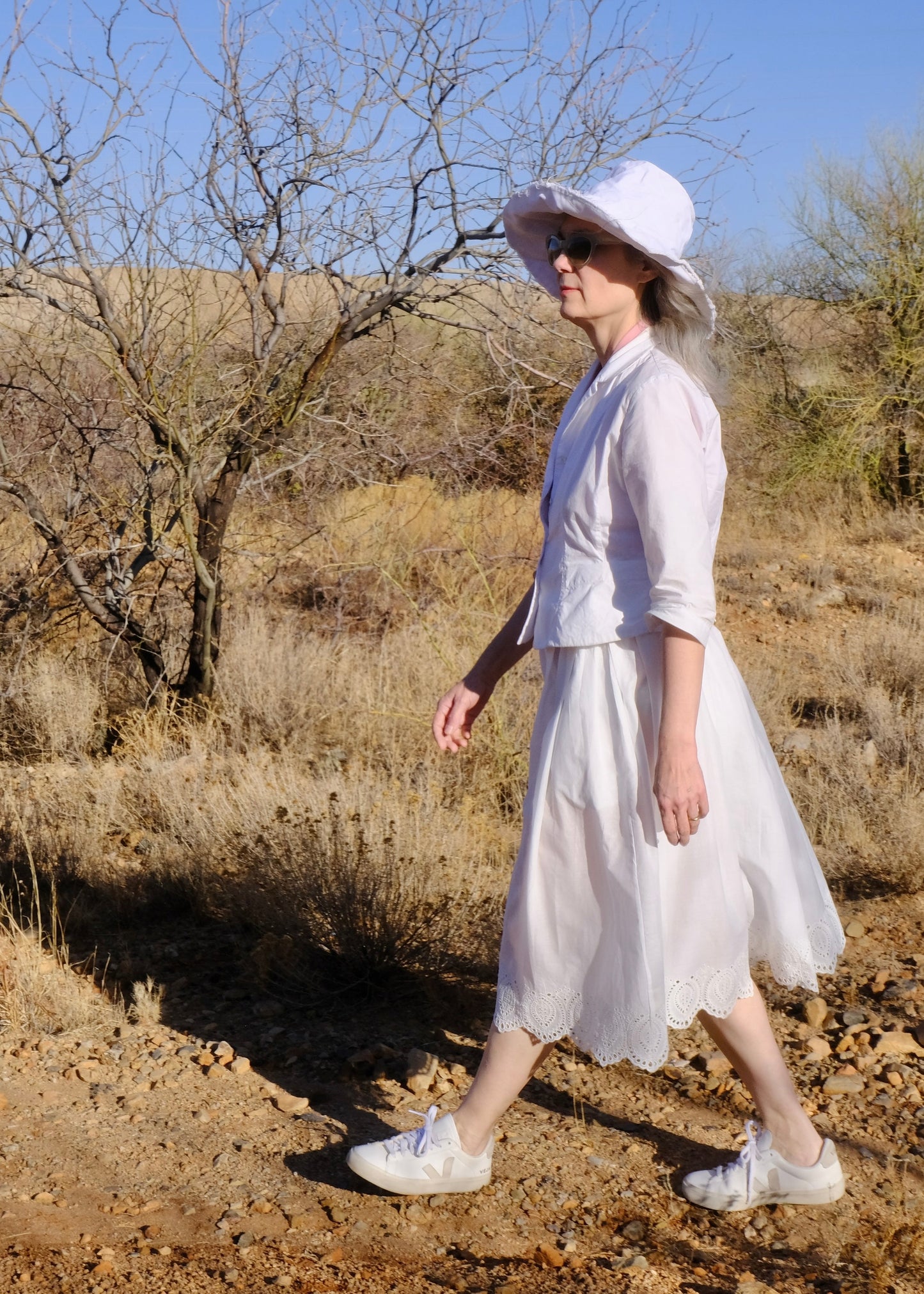 white shorty jacket with white scalloped eyelet belle skirt