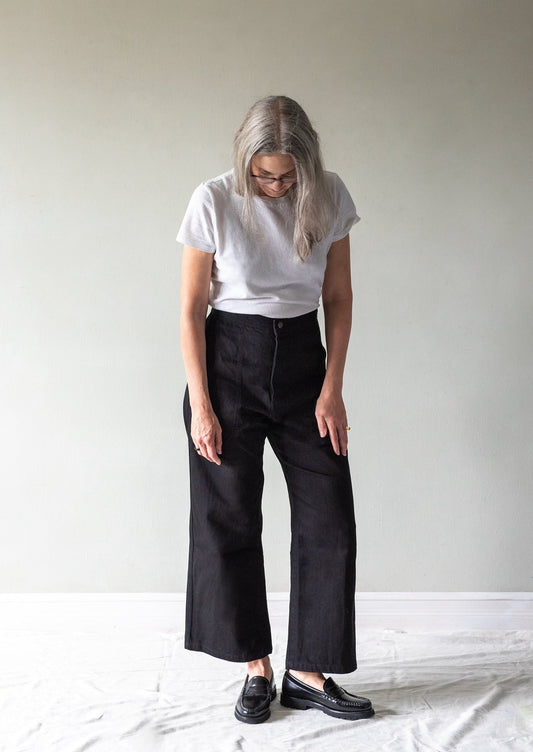 MODEL IN BLACK DENIM SAILOR PANT