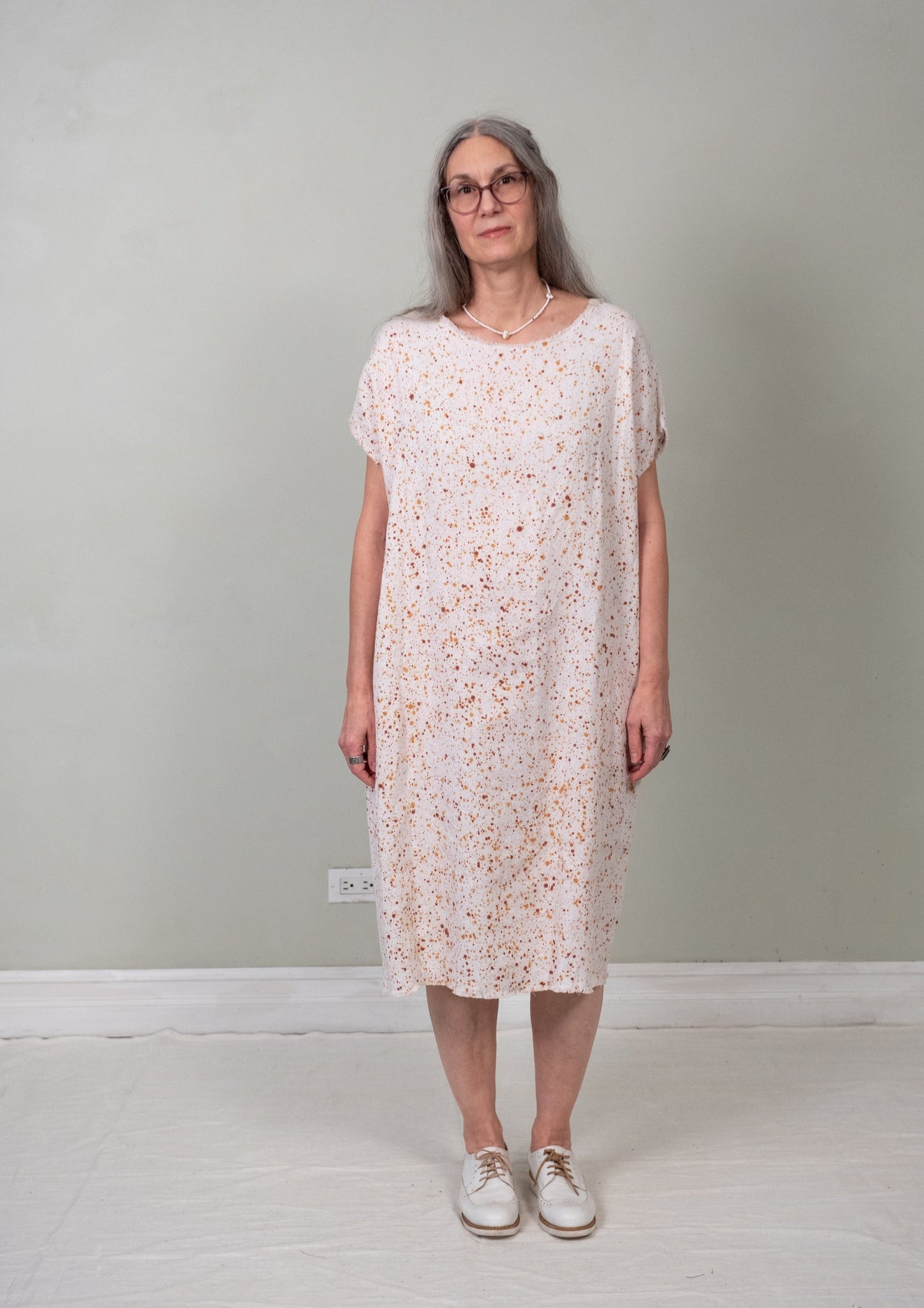 unbelted paint-splatter sack dress front view