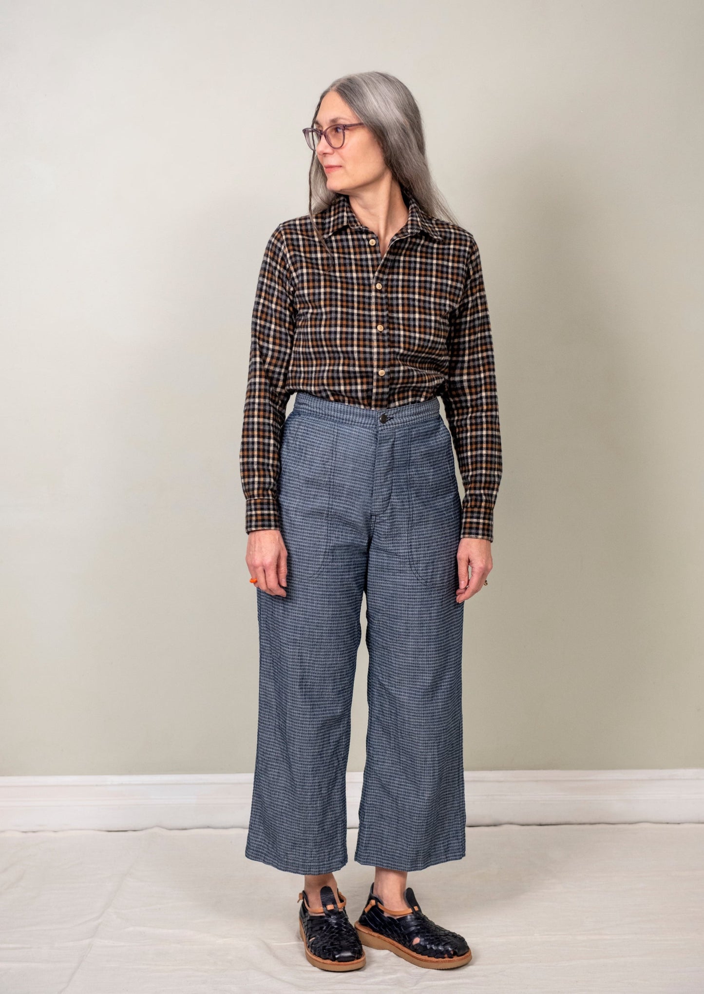 model wearing flannel check shirt