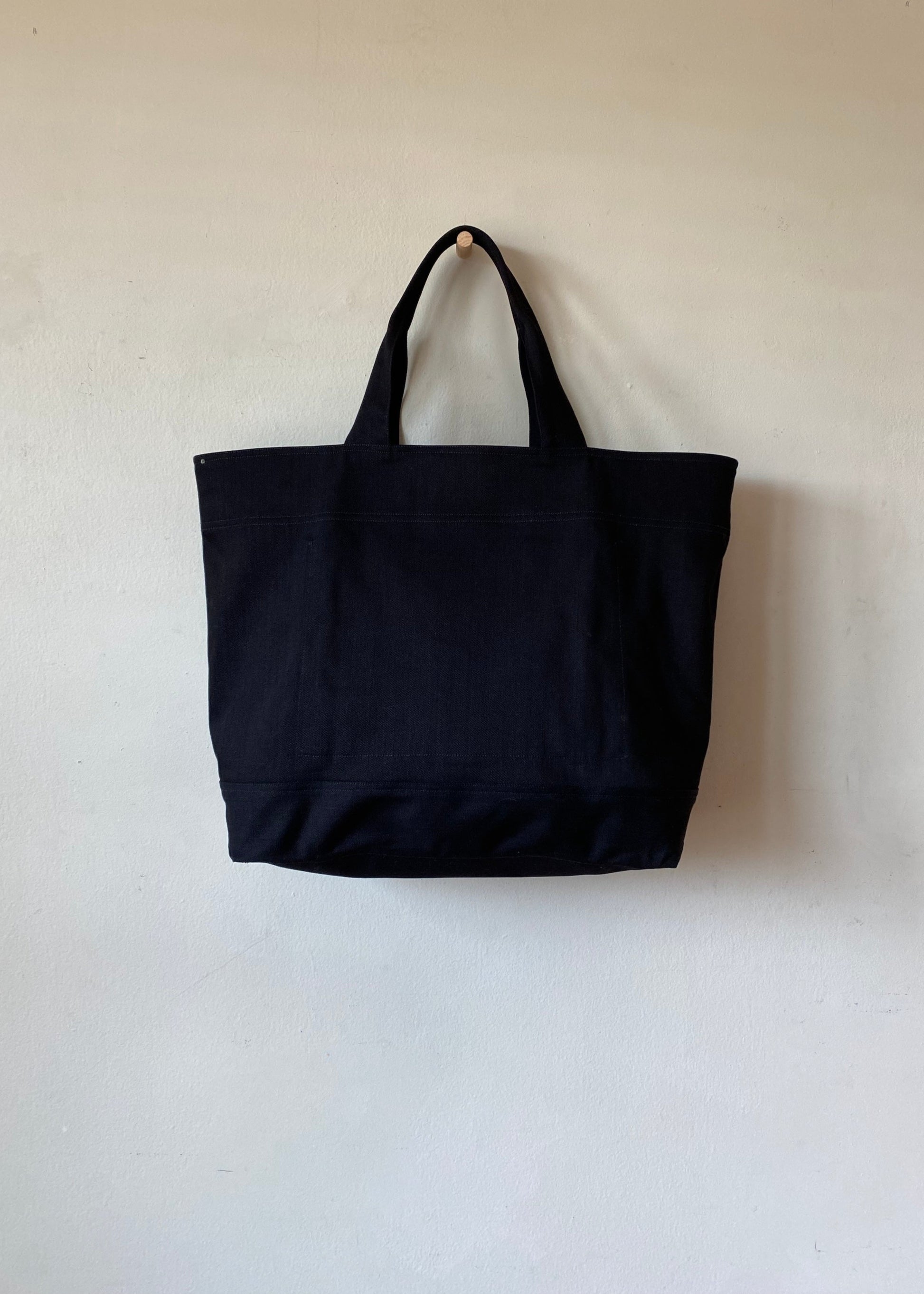 Black tote bag on a white background