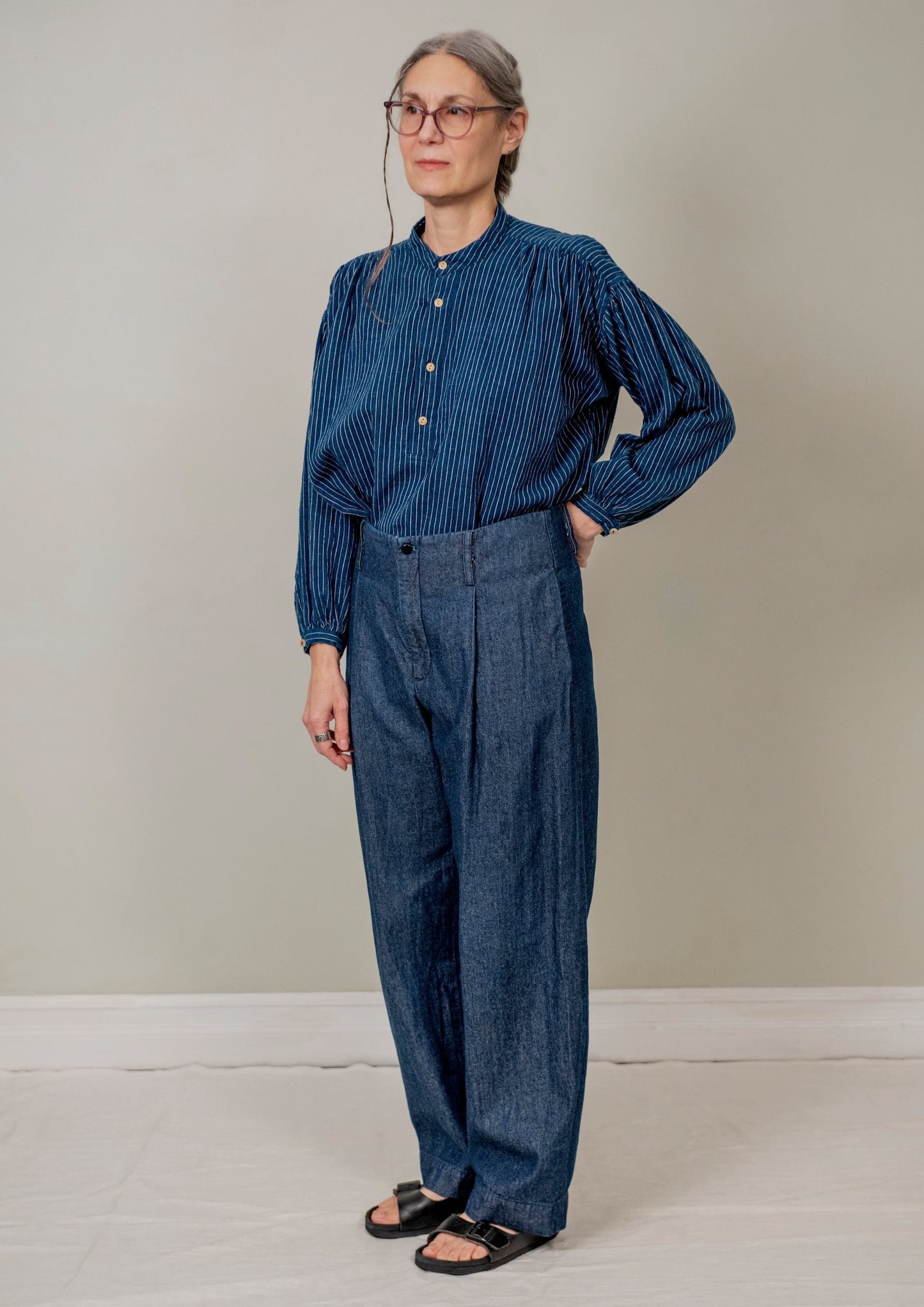 model wearing peasant blouse indigo pinstripe