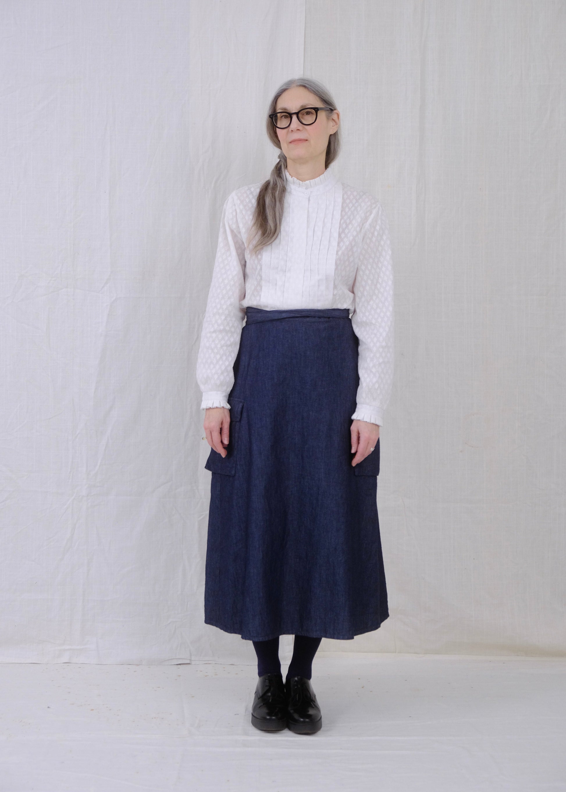 white ruffle blouse and denim cargo wrap skirt