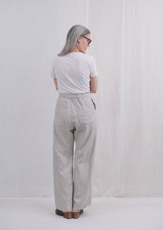 Lazy Sailor Pant in natural undyed linen with elastic in back waistband on model back view