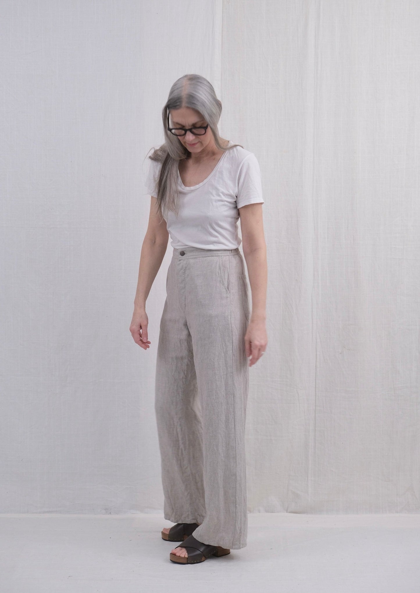 Lazy Sailor Pant in natural undyed linen with elastic in back waistband on model side view
