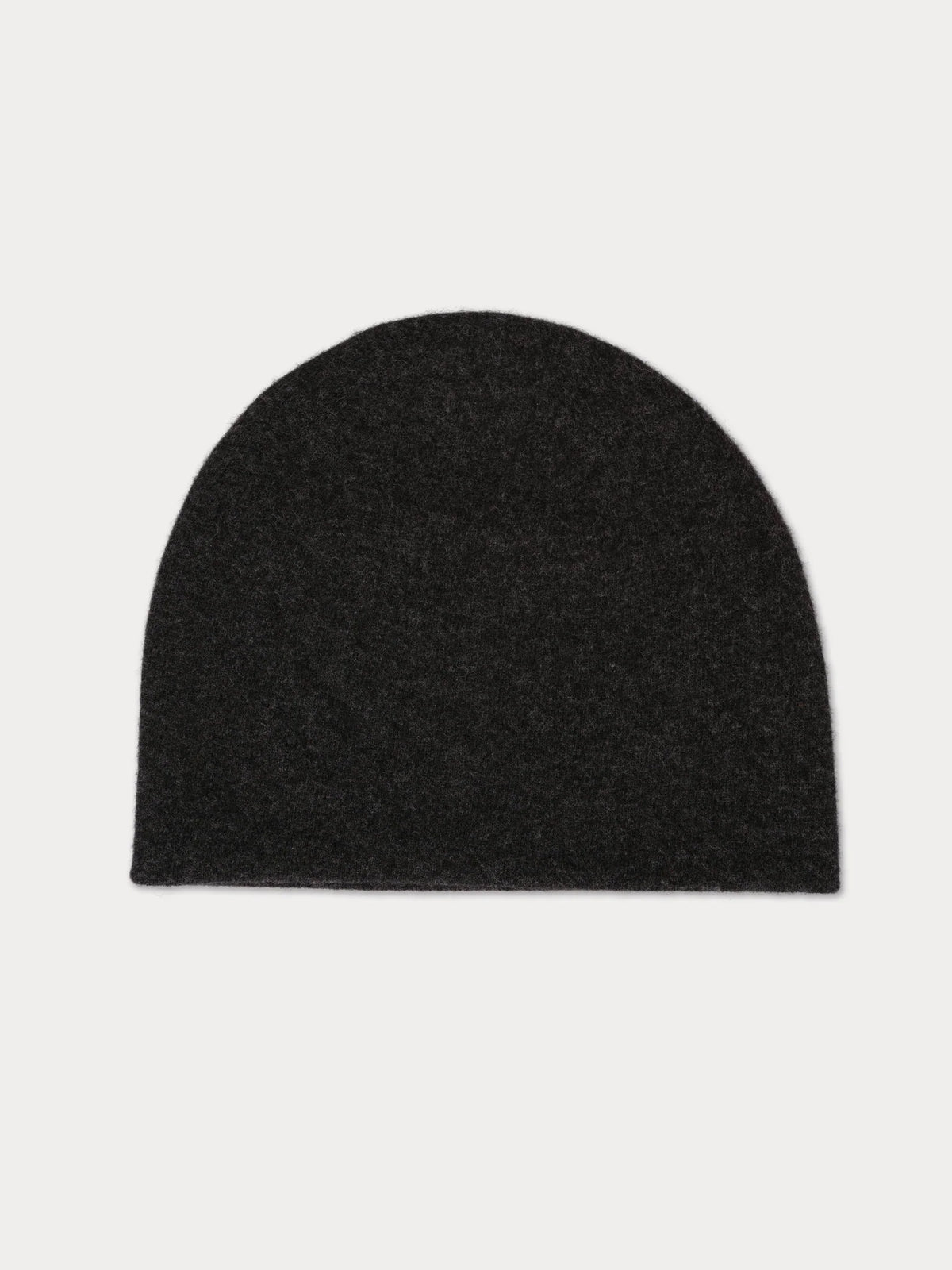 Black beanie hat on a light gray background