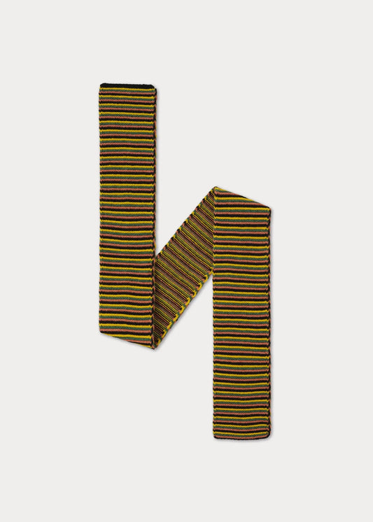 A striped knit scarf folded into an 'H' shape, featuring horizontal stripes of yellow, black, and thin red lines, on a light gray background.